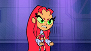 Red Starfire clutching her fists in anger.