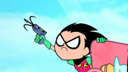 Robin fires his grappling hook.