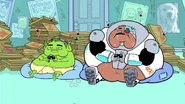 The real Beast Boy and Cyborg playing the game.