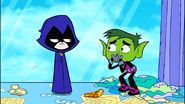 Beast Boy covers his mouth, after realizing he's provoked Raven.