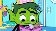 Beast Boy looking through Raven's spellbook.