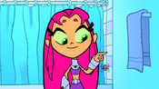 Starfire plays with the spider.