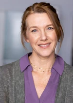 Elise Robertson as Mrs. Raeken