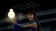 Starfire and Raven a frame before they realize they have switched bodies.