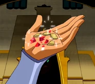 Starfire holding the crushed Jewel of Charta
