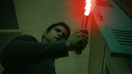 Tyler-Posey-Scott-holding-flare-Teen-Wolf-Season-6-Episode-9-Memory-Found