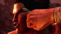 Kazuya's cheek gets hit by Heihachi's fist.