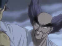 Heihachi speaking to young Kazuya on the cliff top.