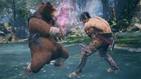 Kuma performing Demon Breath against Marshall Law in a promotional screenshot for Tekken 8.