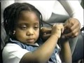 A girl having her hair braided.