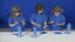 The children painting blue.