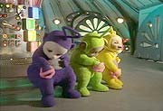 The Teletubbies cleaning their knees with the Tubby Sponges