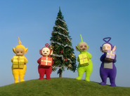 The Teletubbies with their presents