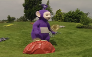 Tubby Toast flying out of Tinky Winky's bag