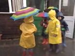 Children playing in the rain.