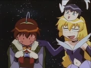 Pixy Misa teases Rumiya after learning he has a crush on herself as Misao. The small  face above symbolizes Misao is now aware of her actions as Misa.