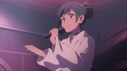 Hina sings karaoke.