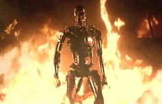 The T-800 endoskeleton standing by an inferno in The Terminator