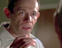 Fleming prepares to slit open Cromartie's eyelids