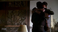 Charley hugs john