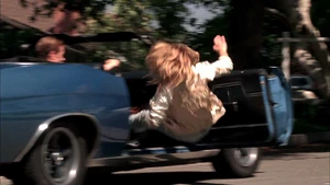 Jody is pushed out of the car by Cromartie