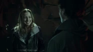 Kara talks to Josh through a hologram.