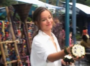 Skye showing how to crack open a sugar apple.