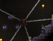 Player wearing spider armor with spider minions and slung webs.