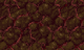 Mur de pierre carmin avec de la mousse rouge poussant sur les rochers