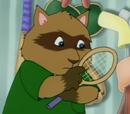 Claude is pointing at the tennis racket.