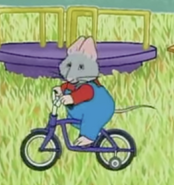 Charles is riding a bike.