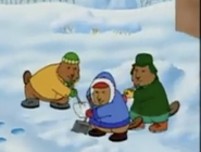 The three brothers are digging in the snow.