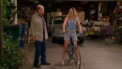 Red teaching Sherri how to ride a bike