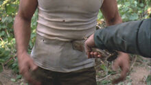 5-8-raymond-knife-to-stomach 528 poster