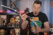 James holding the corpse of his axe