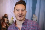 James with Cockatiels on his shoulders
