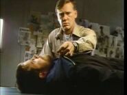 Garry examining Lars' body in a deleted scene