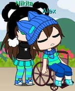 Nikita pushing Alex on his wheelchair while he's asleep. Note that Nikita is wearing blue and white sneakers instead of her brown snow boots.