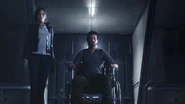 Sebastian in a chair with Juli Kidman at his side