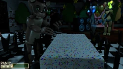 Popgoes placing a piece of the Blackrabbit on the table.