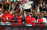 Captain Mikel Arteta lifts the trophy