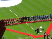 The two teams line up prior to kick-off