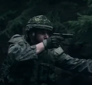 Canadian Army soldier with a Browning Hi-Power pistol.