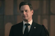 THE-HANDMAIDS-TALE-season-6-episode-5-041725-1db2f7f093c1449b9abe05ed24a76918.jpg (123 KB) High Commander Wharton wearing a Gileadean pin, along with a bit of extra red thread on his black aiguillettes