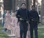 GuardsChildren.png (569 KB) Two Guardians in commando sweaters escorting female children.