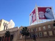 An inflatable Baymax on top of the , near a film poster in 2014