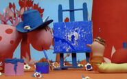 Ermintrude painting blue canvases