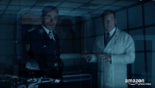 Dr. Mengele explains travelers to John Smith.