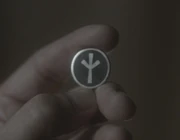 Lebensborn insignia in the form of a pin affixed to one's clothes