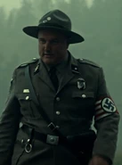 Wells, a former U.S. soldier-turned Nazi police officer